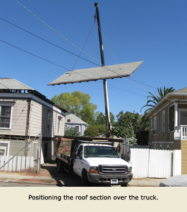 Disassembling the house to move it in pieces.